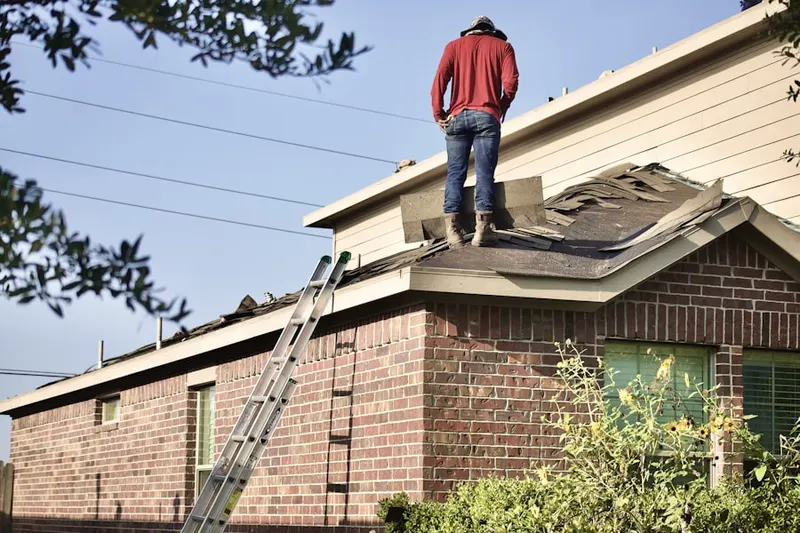 Professional roofer working on a residential roof in Johnson Lane